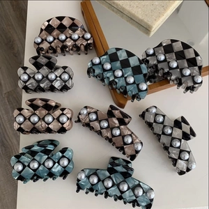 Checkerboard pattern acetate hair claws with pearls in various geometric shapes