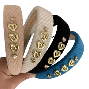 Luxe quilted heart headband set with gold metal accents and sparkling rhinestones
