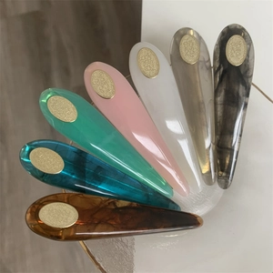Detailed set of seven resin water-drop hair clips in assorted marble and pastel finishes