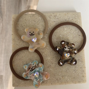 Three-piece set of cartoon bear hair ties with resin marble finish and heart rhinestones
