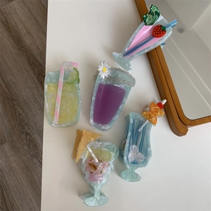 Detailed close-up of colorful summer drink hair clips made of acetic acid on white background