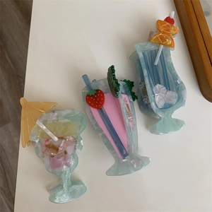 Detail shot of creative cocktail hair clips with tiny umbrellas and summer fruit decorations