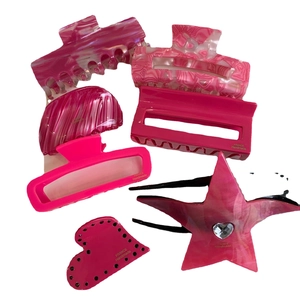Pink acetate hair claw clip set with marble patterns and star heart decorations