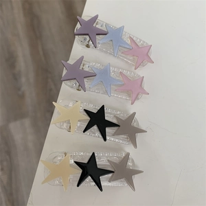 Star hair clips set with frosted pentagrams in pastel and neutral color combinations