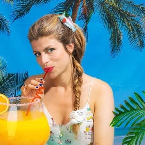 Summer cocktail hair clip set with strawberry decor and floral scrunchie on a model