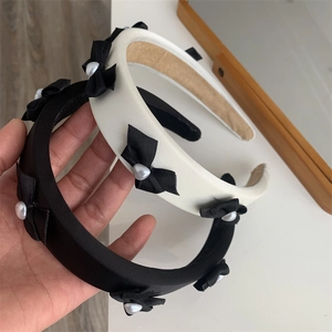 Elegant set of black and white bow headbands with heart pearls for women with high top design