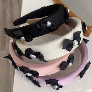 Set of four thick sponge headbands with satin bows and heart-shaped pearls in mixed colors