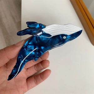 Blue and white whale-shaped acetate hair claw clip with marble texture for women