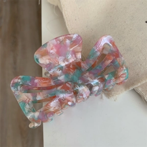 Pink marble acetate hair claw clip with colorful floral pattern and hollow texture