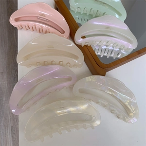 Detailed side view of acetate crescent hair claws with France Handmade engraving