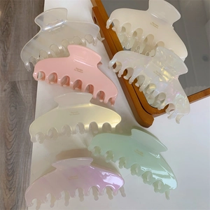 Elegant large acetate shark hair claws in multiple soft pastel pearlescent colors