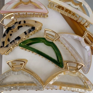 Minimalist metallic acetate arch hair claw clips in various colors for elegant styling
