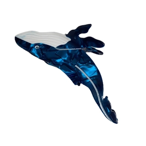 Blue whale shaped marble pattern hair claw clip made of acetate with white wave design