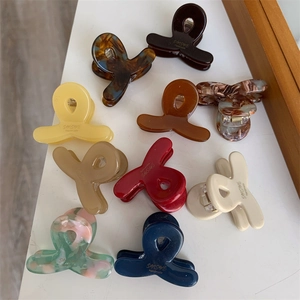 Lot de 10 pinces à cheveux en acétate coloré avec design croisé et finition marbrée
