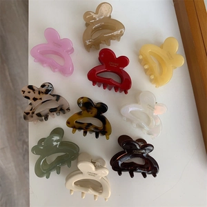 Cute bunny ear hair clips in multiple colors with SIMSHINE handmade logo on white background