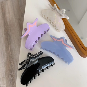 Chic acetate star claw clip set in iridescent white, lilac, blue and black