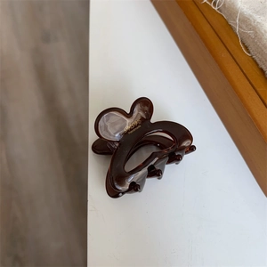Tortoiseshell patterned hair claw clip with golden Sunshine Handmade lettering for women