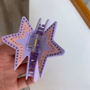 Chic purple acetate star claw clip with pink rhinestones for elegant hair styling
