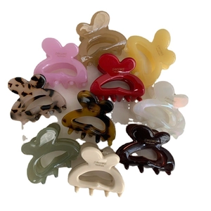 Set of 10 rabbit ear hair clips with diverse finishes like pearl, matte, and tortoiseshell