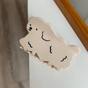 Cute cream dog hair claw clip with creative cartoon design made of polished acetate material