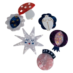 Set of 6 artistic acetate hair clips featuring mushroom, moon, and abstract star designs