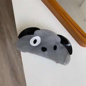 Detail view of the gray marble pattern acetate puppy hair claw clip showing the dog design