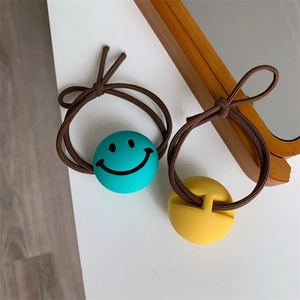 Cute smiley face hair ties set featuring blue and yellow matte beads on brown elastic rope