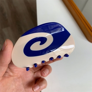 Blue and beige acetate hair claw clip with unique swirl design for women hair styling