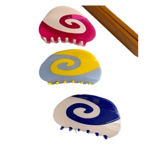 Three-piece set of abstract swirl pattern acetate hair claws in vibrant color blocking