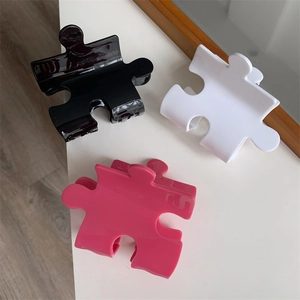 Creative puzzle block hair claws in black white and pink with glossy finish