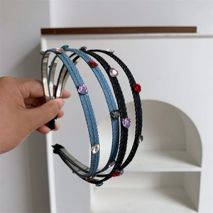 Detail showing heart-shaped rhinestones on double-strand denim and woven headbands