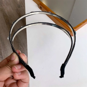 Detail of double-layer metal headband featuring sparkling rhinestones and protective tips