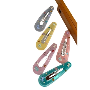 Five-piece colorful butterfly hair clips set with rhinestones on a white background
