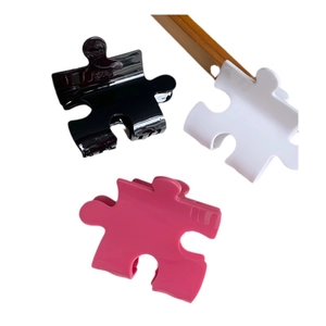 Creative puzzle design acetate hair claws in black, white, and pink block styles