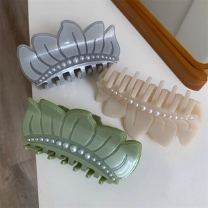Elegant floral lotus leaf hair claw clip with pearls in blue, beige and green colors