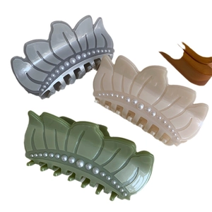 Elegant lotus pearl acetate claw clips in cream, grey, and green crown shapes