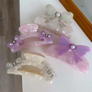 Chic purple and cream acetate hair claw clips with elegant bow and pearl accents