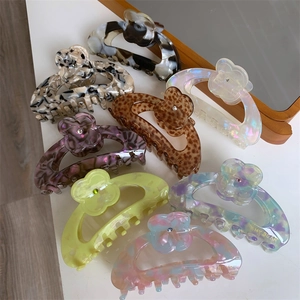 Floral acetate hair claw clip set with marble patterns and sparkling 3D flower accents
