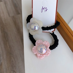 Floral elastic hair ties in black with pearlescent pink and white flower charms