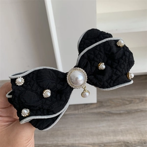 Vintage layered black bow hair clip with elegant pearls and sparkling rhinestones