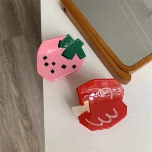 Cute strawberry and apple hair claws in pink and red acrylic resin with glossy finish