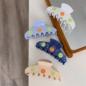 Elegant fruit-themed hair claws with lemon slices and rhinestones in four stylish colors