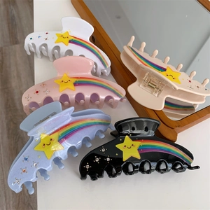 Rainbow star hair claws in five colors with rhinestones and smiley face design