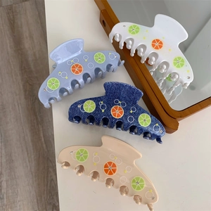 Fresh lemon and orange patterned hair claw clips with rhinestones in four colors
