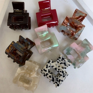 Set of 7 colorful square geometric hair claws in marble, tortoiseshell and solid patterns