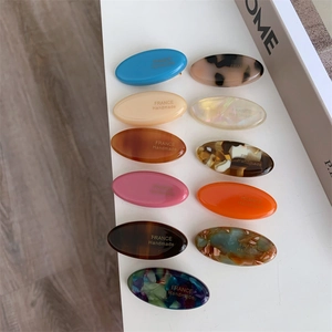 Set of 11 assorted acetate hair clips with marble patterns and France Handmade gold lettering