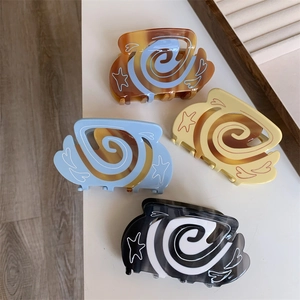 Artistic coffee style acetate hair claws with swirl patterns and heart star engravings