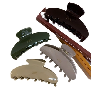 Elegant acetate hair claws set with France gold lettering in four vintage colors
