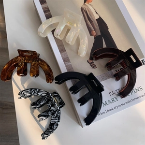 Set of five elegant French acetate hair claws in various vintage marble patterns and colors