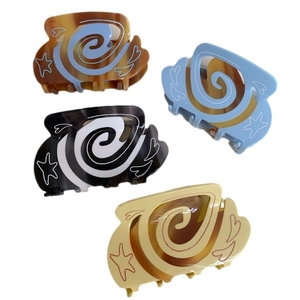 Set of four colorful heart and star pattern hair claws with vintage Y2K aesthetic
